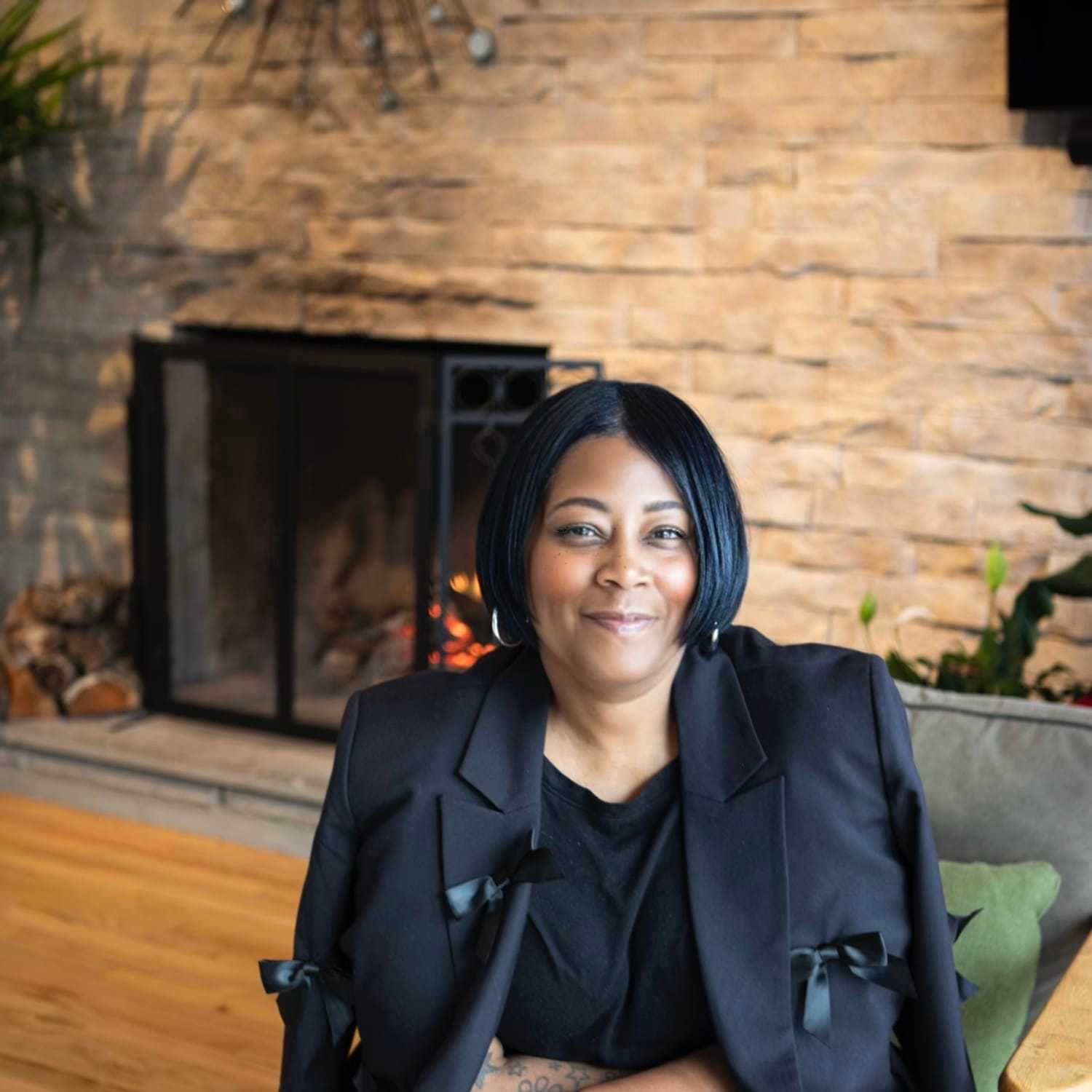 Portrait of Cynthia Haughton, a professional stylist at Studio Raw Elite, showcasing their expertise and style.